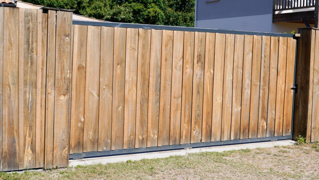 Brown portal natural wooden gate of private house in suburb